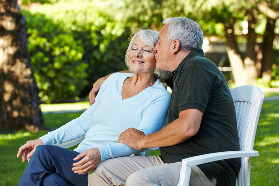 bigstock-Senior-man-kissing-his-woman-i-41913676